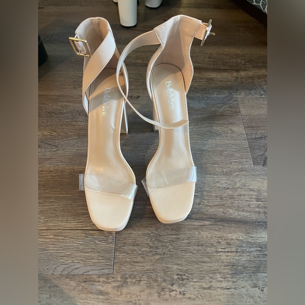 Nude heels with clear strap over toes